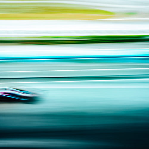 Formula 1 car at speed, photographed with the exclusive Formula 1 Leica Look