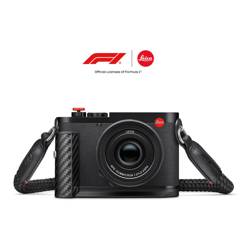 Leica Q3 43 Formula 1 Edition with carrying strap, front view, official F1 and Leica partnership logo