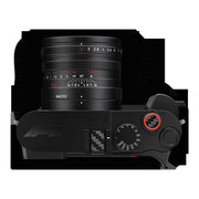 Top plate of the Leica Q3 43 Formula 1 Edition showing the red soft-release button and carbon-fibre insert